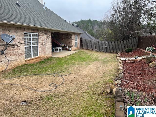 view of yard featuring a patio and a fenced backyard