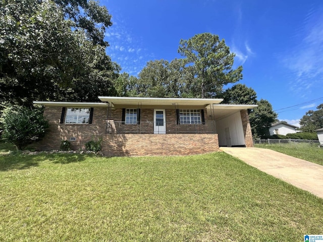 ranch-style home with crawl space, fence, an attached carport, driveway, and a front lawn