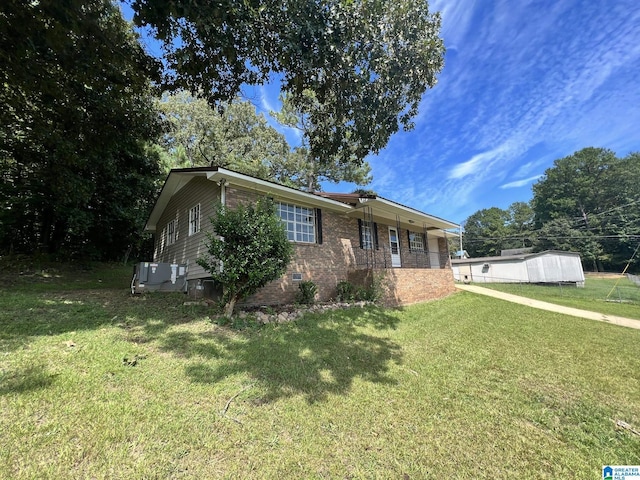 ranch-style home with brick siding, crawl space, and a front yard