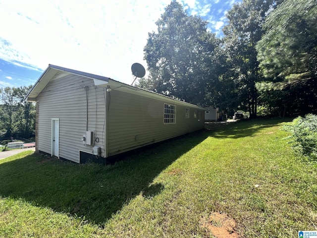 view of home's exterior with a lawn