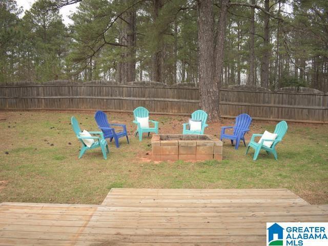 view of yard with a fenced backyard and a wooden deck