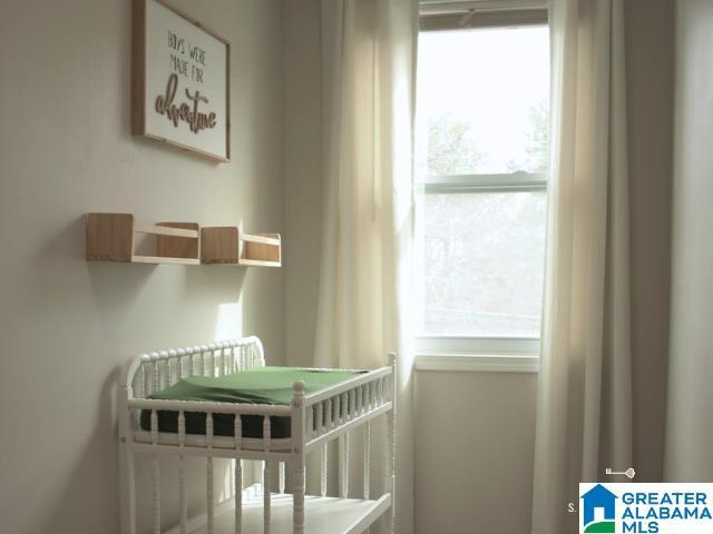 unfurnished bedroom with a crib