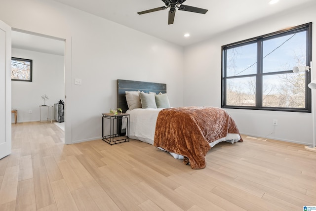 bedroom with ceiling fan, recessed lighting, light wood-type flooring, and baseboards