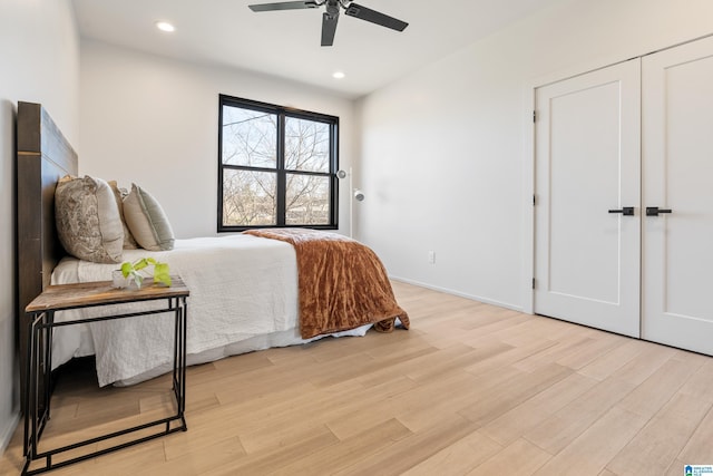 bedroom featuring baseboards, recessed lighting, a ceiling fan, and light wood-style floors