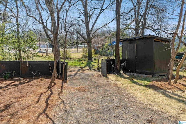 view of yard with a storage unit and an outdoor structure