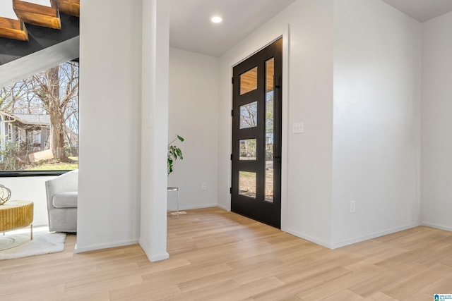 entrance foyer featuring recessed lighting, light wood-style flooring, and baseboards