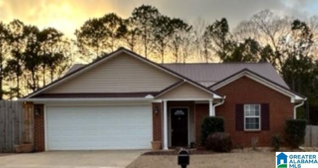 view of front facade with driveway and an attached garage