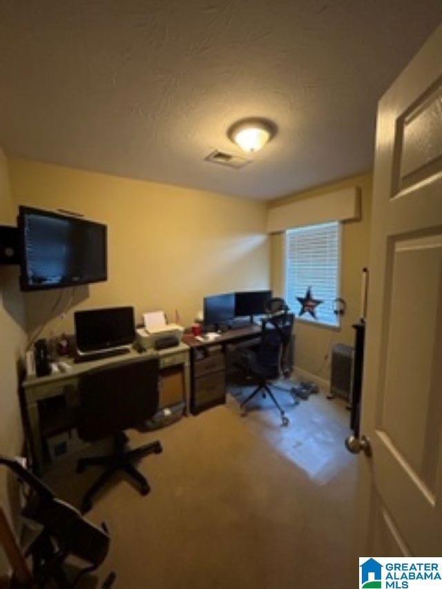 office area with carpet floors and visible vents