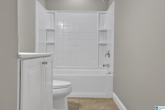 full bath with bathtub / shower combination, toilet, vanity, baseboards, and tile patterned floors