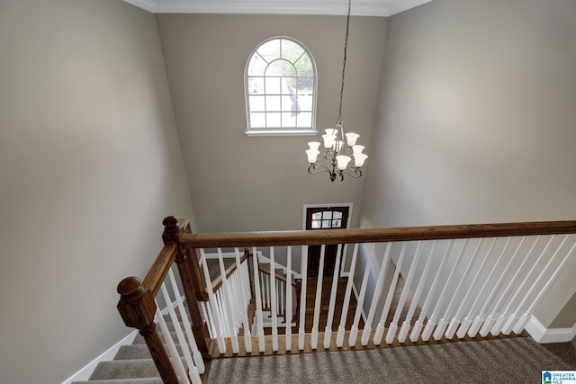 stairs featuring carpet, baseboards, a chandelier, and crown molding