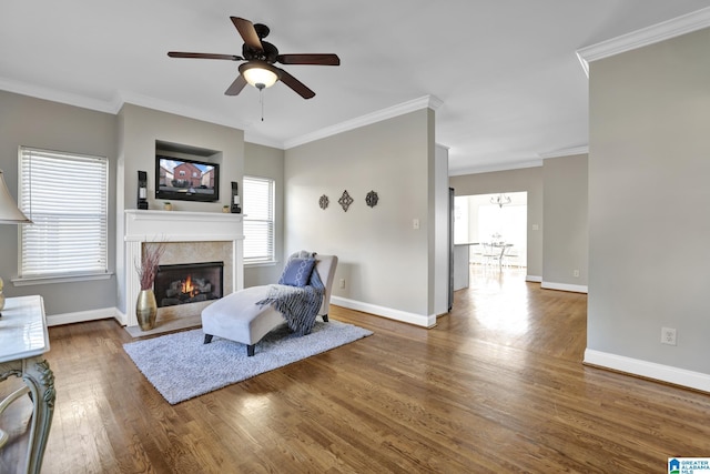 living room with plenty of natural light, a fireplace, baseboards, and dark wood finished floors