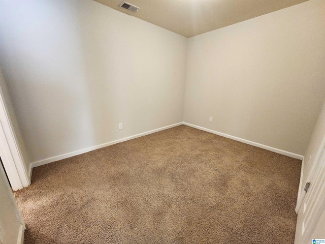 carpeted empty room with baseboards and visible vents