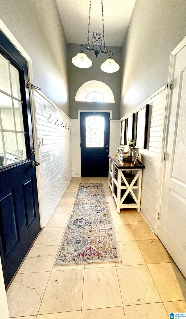 foyer featuring a towering ceiling