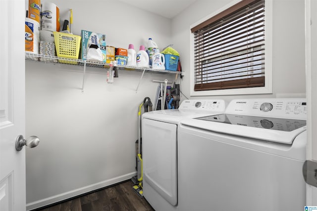 clothes washing area with laundry area, baseboards, dark wood-style floors, and separate washer and dryer