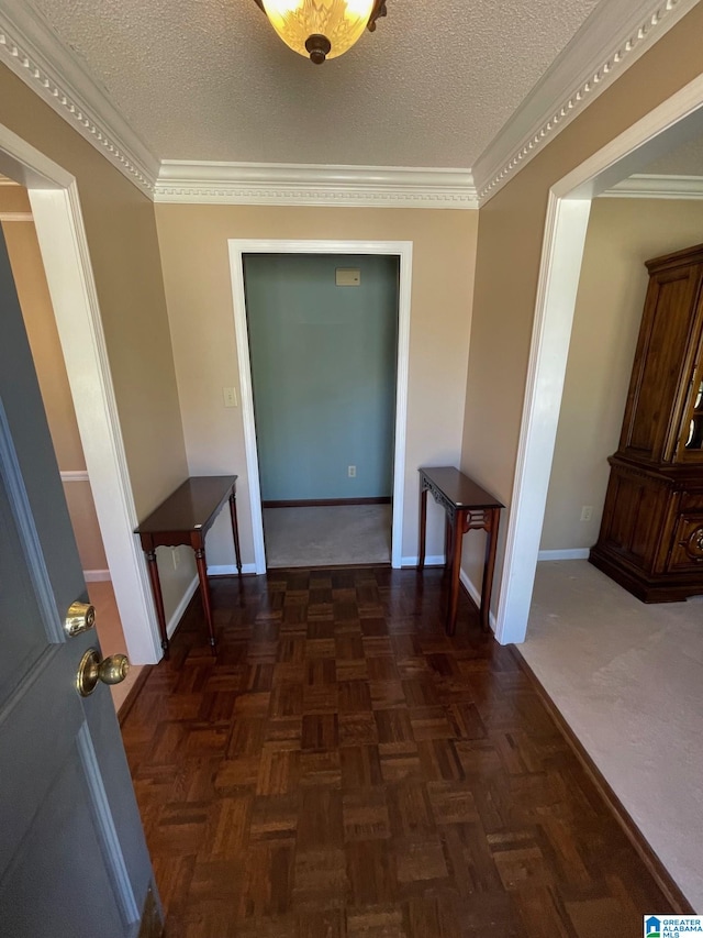 corridor featuring baseboards and a textured ceiling