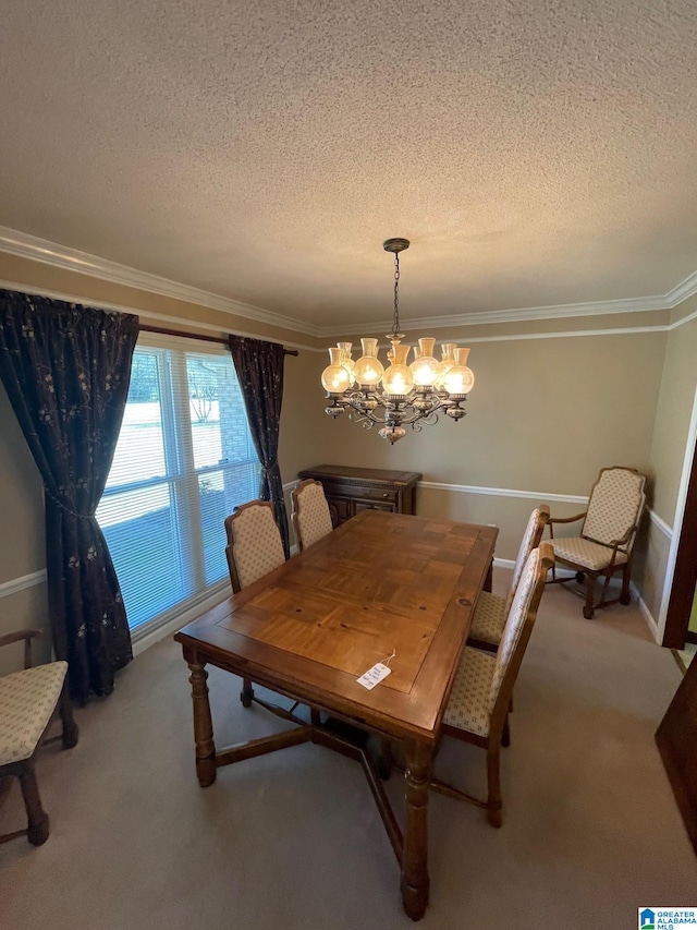 dining area with an inviting chandelier, carpet, ornamental molding, and a textured ceiling