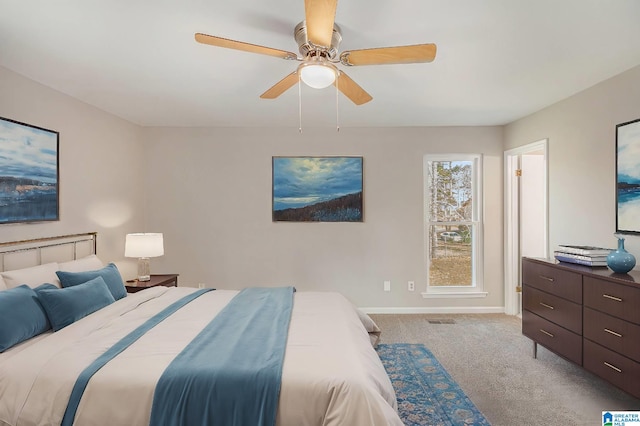 bedroom with a ceiling fan, carpet, visible vents, and baseboards