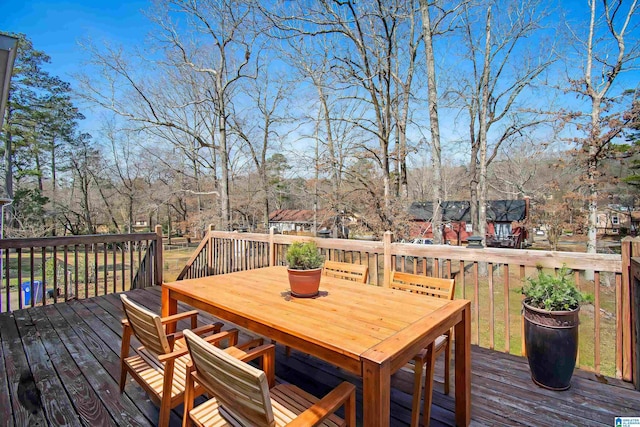 wooden terrace featuring outdoor dining area