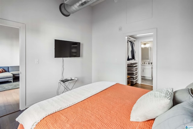 bedroom with wood finished floors