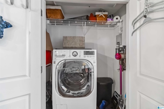 laundry room featuring washer / dryer and laundry area