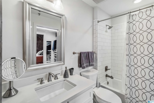 full bathroom featuring toilet, visible vents, vanity, and shower / tub combo with curtain