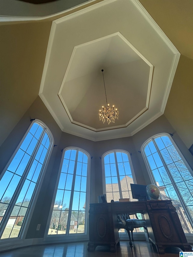 interior details featuring a chandelier and ornamental molding