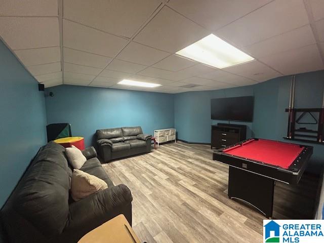 playroom featuring a paneled ceiling, billiards, and wood finished floors