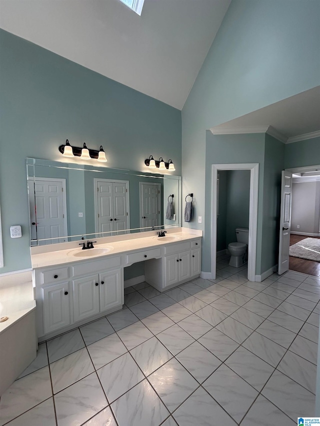 full bath featuring high vaulted ceiling, toilet, a sink, ornamental molding, and double vanity