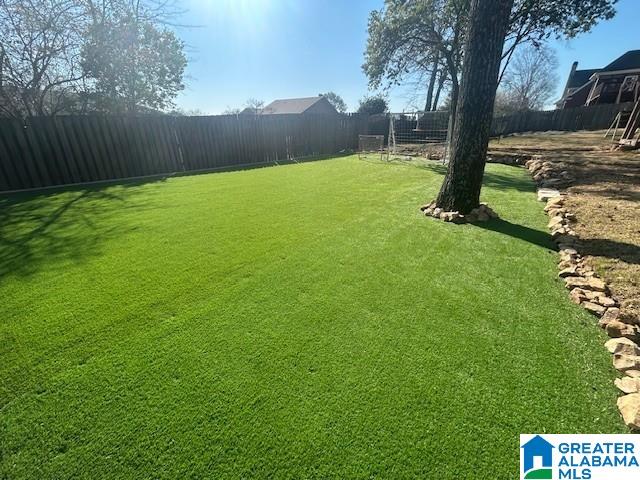 view of yard featuring a fenced backyard