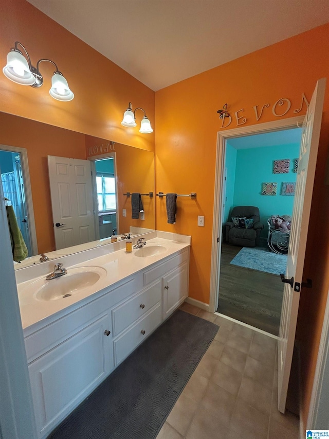 full bath featuring double vanity and a sink