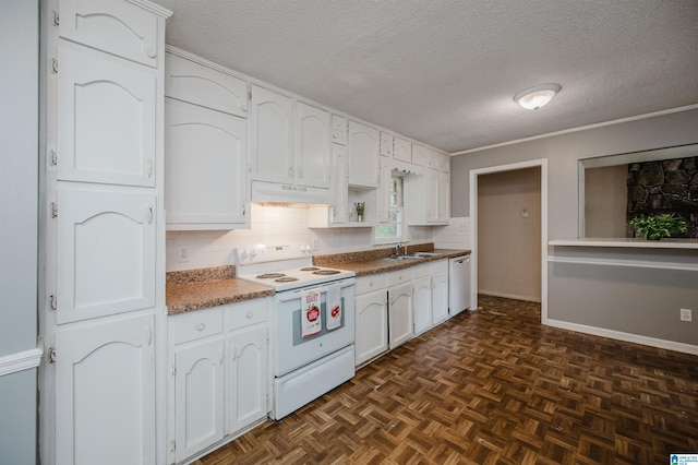 kitchen featuring a textured ceiling, under cabinet range hood, white appliances, a sink, and white cabinets