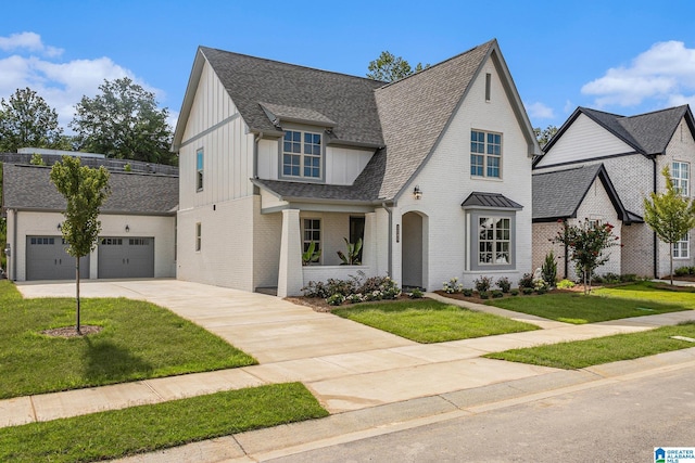 view of front facade with board and batten siding, concrete driveway, brick siding, and an attached garage