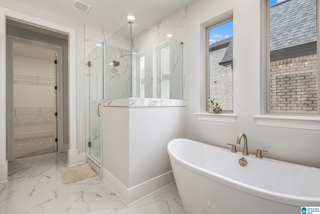 full bathroom with a marble finish shower, visible vents, a soaking tub, marble finish floor, and a spacious closet