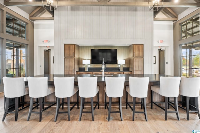 kitchen featuring a breakfast bar area and light wood-type flooring