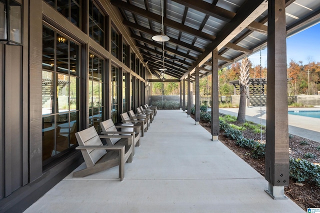 view of patio / terrace featuring a fenced in pool and fence