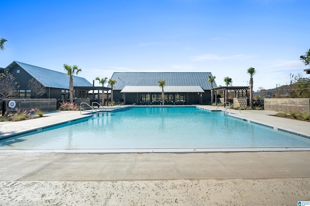 pool featuring a pergola and a patio