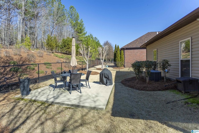 view of patio with cooling unit and a fenced backyard