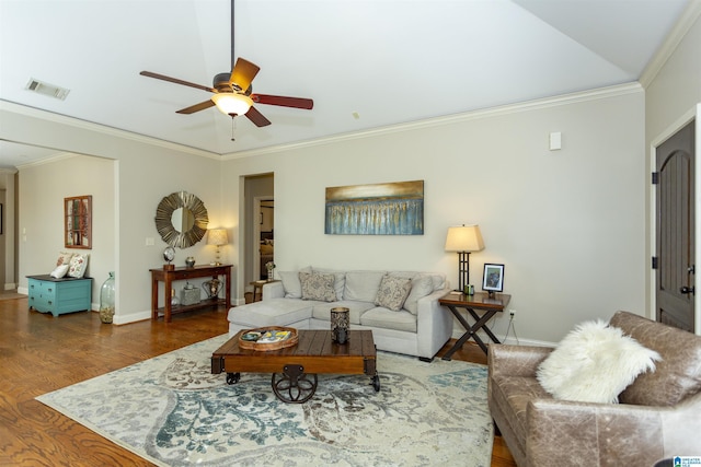 living area featuring ceiling fan, visible vents, wood finished floors, and ornamental molding