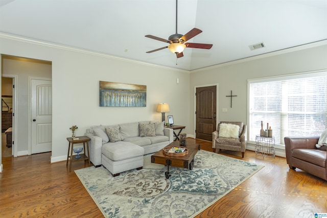 living room with crown molding, baseboards, ceiling fan, and wood finished floors