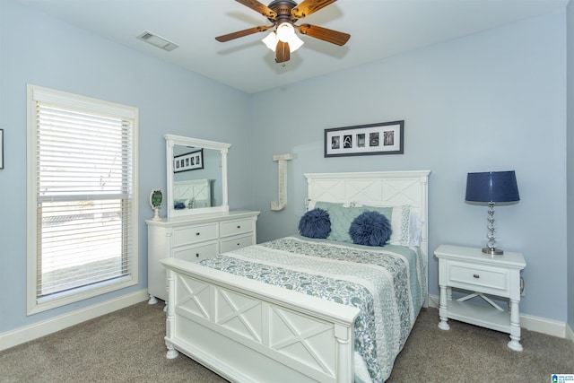 bedroom with a ceiling fan, carpet, visible vents, and baseboards