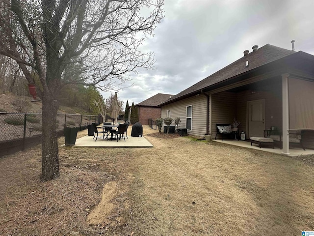 view of yard featuring a patio and fence