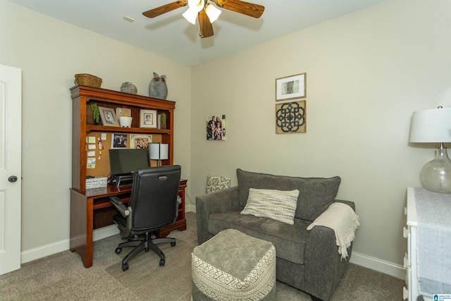 office space with carpet floors, a ceiling fan, and baseboards