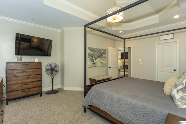 carpeted bedroom with baseboards, a tray ceiling, crown molding, and recessed lighting