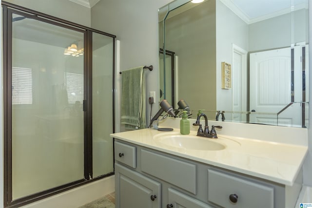 bathroom featuring a shower stall, ornamental molding, and vanity