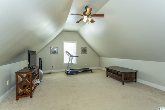 workout area featuring lofted ceiling, carpet floors, and baseboards