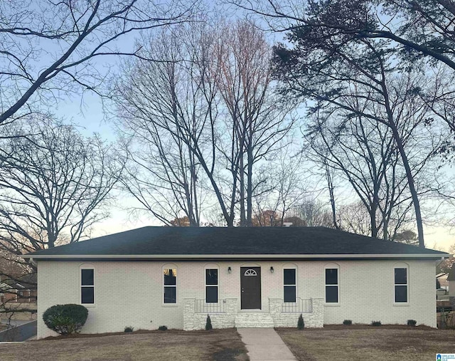 view of front of house featuring brick siding