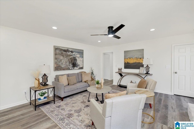 living area featuring ceiling fan, baseboards, wood finished floors, and recessed lighting