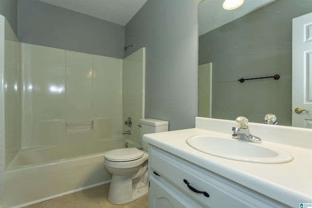 bathroom featuring shower / washtub combination, tile patterned flooring, vanity, and toilet