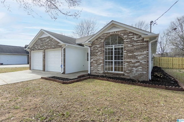 ranch-style home with concrete driveway, brick siding, an attached garage, and fence