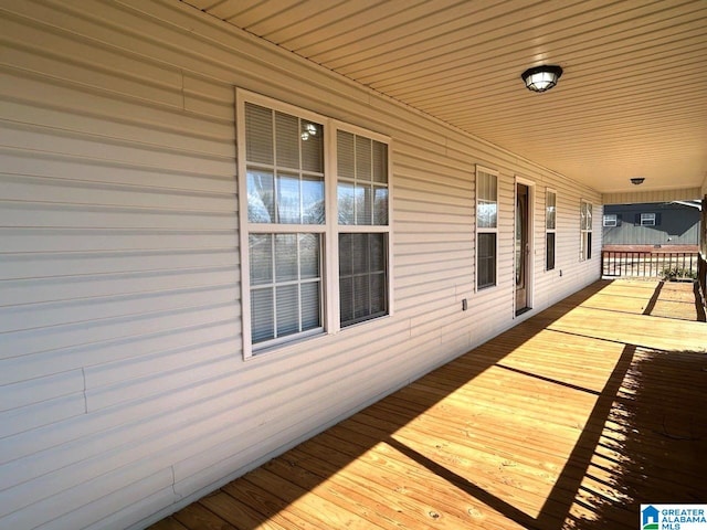 wooden terrace featuring covered porch